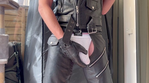 Erotic display of my leather-clad booty and bulge in chaps, boots, jockstrap, and gloves