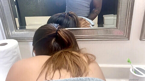 Sneaky shower peek! Ebony cock slips under towel while young Asian sucks for a facial!