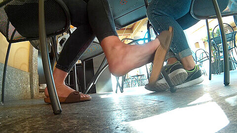 Candid soles under table, under table foot slave, dangling italian
