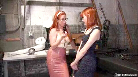 Redhead lesbian boss dominates and anally penetrates her employee