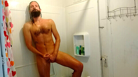 Slim bearded hunk jerks off in the bathroom