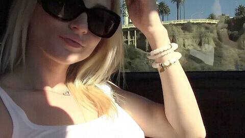 Horny blonde Haley Ryder pleasures herself in her car on a public parking lot