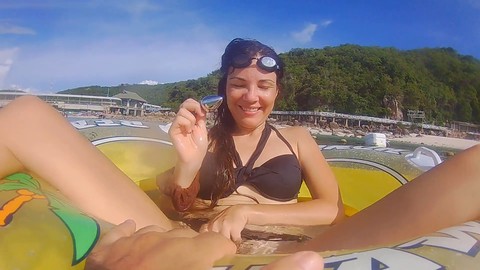 Adventurous girl enjoys anal pleasure with a butt plug amidst marine life and coral reefs