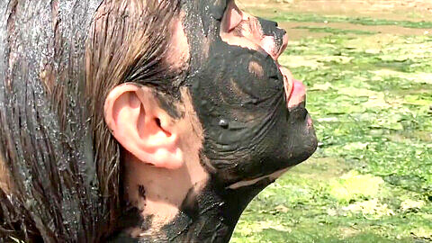 Adorable girl gets messy with mud and pink gunge in a wild sploshing adventure!
