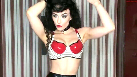 Sensual latex tease with muscular beauty PenelopeWoodsB in red and white outfit