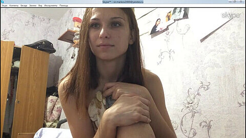 Russian chick strips & masturbates with fingers