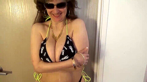 Tinja38DD sprays from her pineapple bikini top - MILF with massive natural boobs