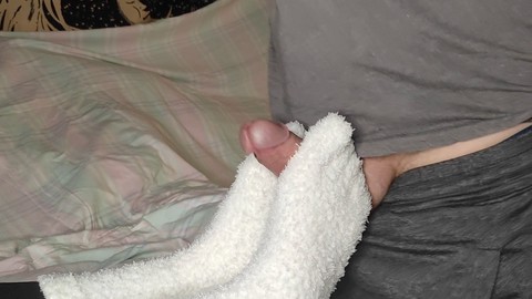 Loulou demands a footjob wearing her cozy white fuzzy socks